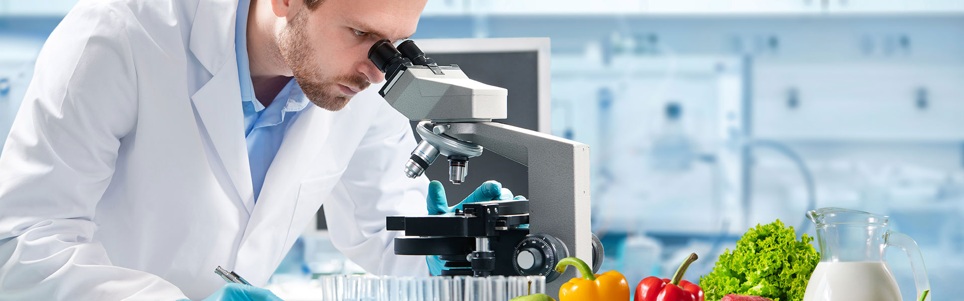 man looking through a microscope